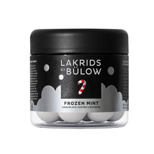 Load image into Gallery viewer, A jar of Lakrids by Bülow Frozen Mint chocolate coated liquorice, featuring a black lid and label with white text and a red-and-white candy cane graphic, containing round white balls inside a clear container.