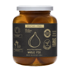 Load image into Gallery viewer, A jar of Whole Fig Nectar + Peel whole fruit preserves by Discover Curated Patcherie, featuring amber glass, a white lid, and a dark charcoal label with gold text and graphics.