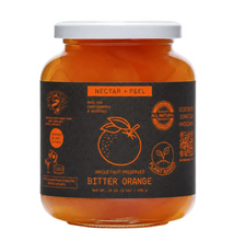 Load image into Gallery viewer, A jar of Bitter Orange Nectar + Peel whole fruit preserves with a dark charcoal label and white lid, shown on a light gray background.