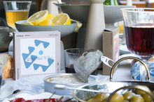 Load image into Gallery viewer, Box and open tin of ABC+ mackerel fish with olive oil cream sauce.
