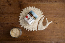 Load image into Gallery viewer, raw Acquerello Rice shaped like a Snail with a tin of rice with Slow Food logo