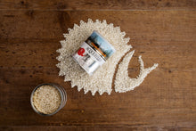 Load image into Gallery viewer, raw Acquerello Rice shaped like a Snail with a tin of rice with Slow Food logo