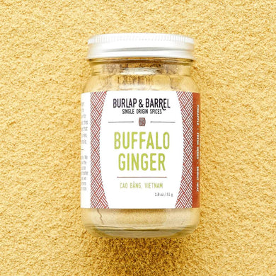 jar of Burlap & Barrel ground Buffalo Ginger with yellow ginger background.