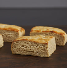 Load image into Gallery viewer, gluten free biscuits, cut into rectangles, on a dark brown cutting board