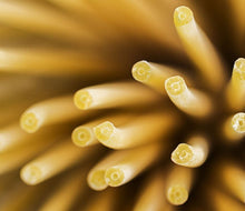Load image into Gallery viewer, close-up of bucatini pasta holes