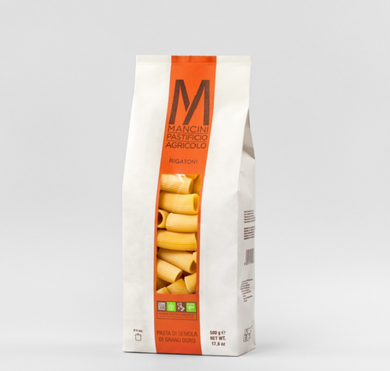 white and orange bag of estate grown Mancini Pastificio Agricolo pasta, durum semolina wheat, Le Marche, Italy.