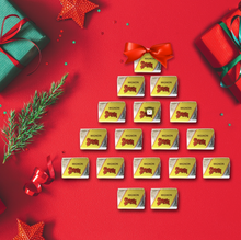 Load image into Gallery viewer, Strega mini torrone chocolate bars arranged on a red surface with Christmas decorations.
