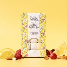 Load image into Gallery viewer, Le Petit Luc Assortiment de Caisseuses Les Fruites box of fruit-flavored marshmallows, styled with raspberries, almonds, and lemon slices on a yellow background.
