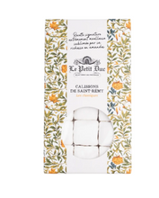Load image into Gallery viewer, Le Jett Duc Calissons de Saint-Rémy tablet wax melts in a tall rectangular box with a white center label, floral green and orange borders, and a clear window showing the white tablets inside. Text below reads 'Calissons from Saint-Rémy, tablet'.

