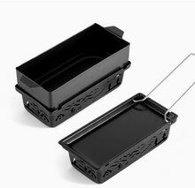Load image into Gallery viewer, Two black rectangular metal loaf pans with decorative cutout sides and a wire lifting handle, shown on a clean white background.
