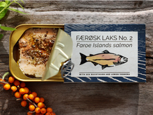 Load image into Gallery viewer, Tin of opened Fangst Faroe Islands salmon with sea buckthorn and lemon verbena.
