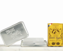 Load image into Gallery viewer, Silver tin and yellow box with branding on a white background, Feret Parfumeur, France
