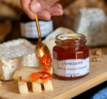Load image into Gallery viewer, Jar of L'Epicerie Piment d'Espelette jelly with a spoonful on a cheese board
