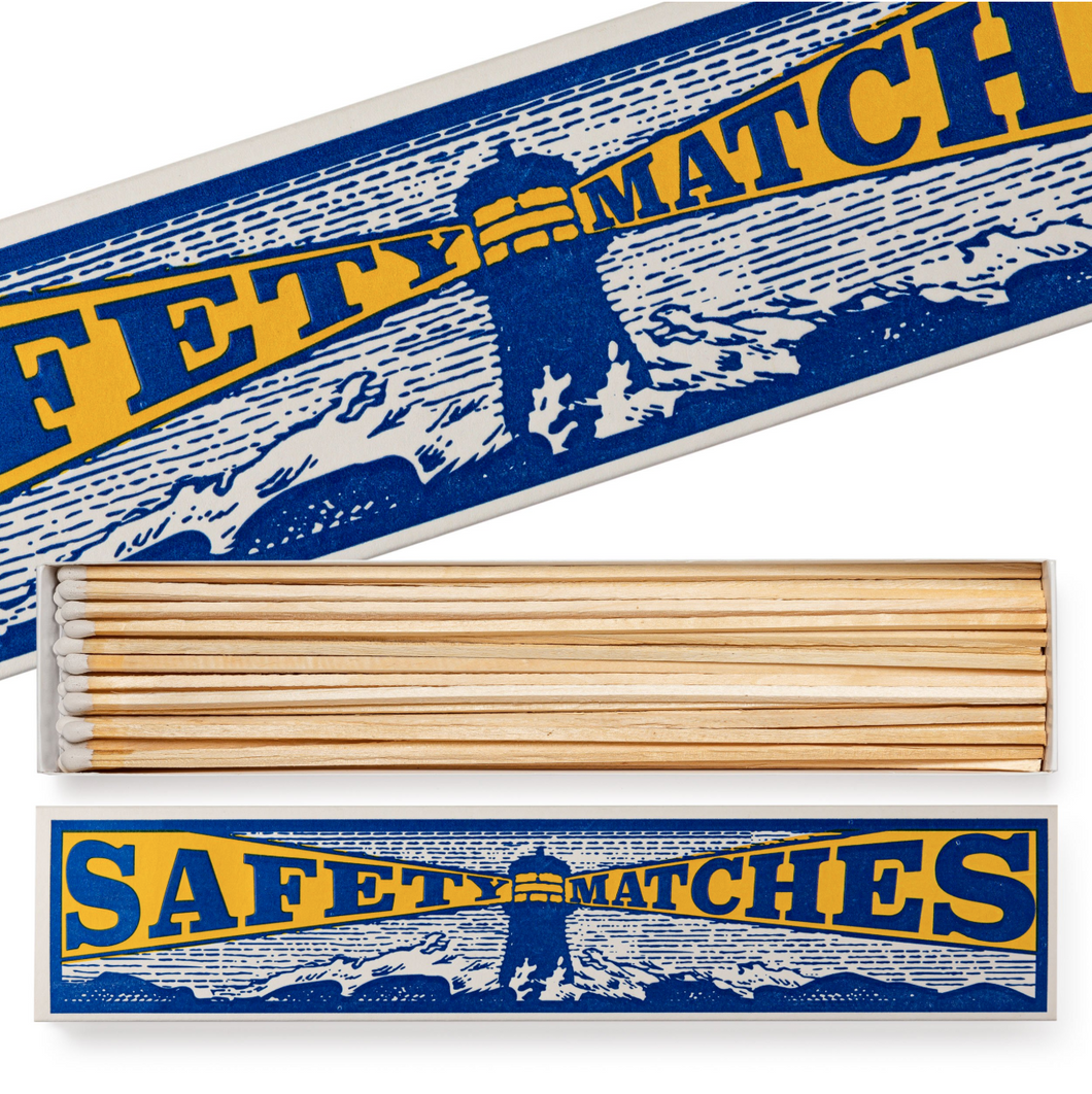 Box of safety matches with blue and yellow labels on a white background, Archivist Gallery