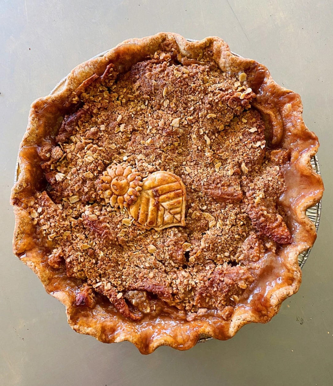 beautiful dutch apple crumble pie with flower and leaf crust cut out