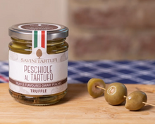Load image into Gallery viewer, Jar of Savini Tartufi truffle-flavored dwarf peaches on a wooden surface with olives.

