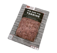 Load image into Gallery viewer, A packaged slice of pig and fig terrine on a white background. The product is sealed in a clear plastic sleeve and presented on a patterned gray card backing with a black label that reads 'PIG AND FIG TERRINE' and the Cooking for Change logo.
