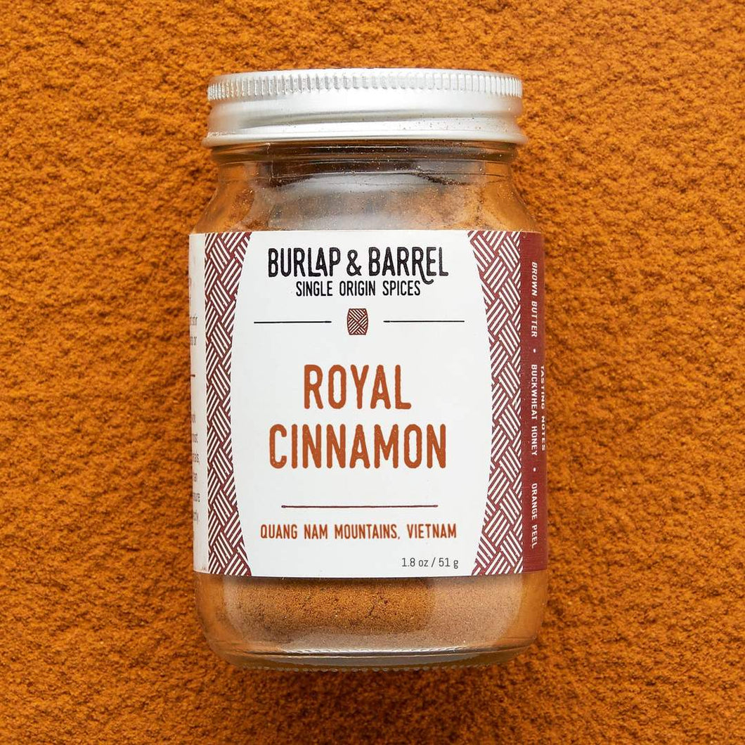 small glass jar with white label of Burlap & Barrel Royal Cinnamon