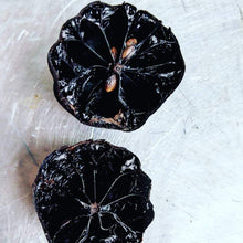 Load image into Gallery viewer, Black Limes Cut in Half
