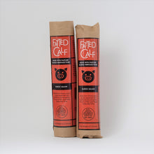 Load image into Gallery viewer, Two kraft wrapped, with red and black label, Fatted Calf single breed Duroc salami.

