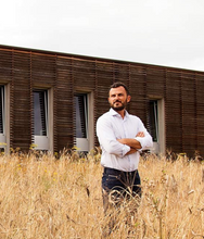 Load image into Gallery viewer, Mr Mancini standing in the wheat fields, outside his factory in Marche, Italy
