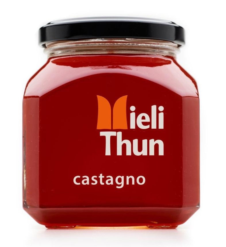 Large square glass jar of Mieli Thun's Italian  raw, single flora, deep amber chestnut honey, 250 g.