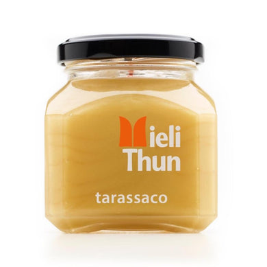 Bright yellow Dandelion Honey in square jar, from Mieli Thun.