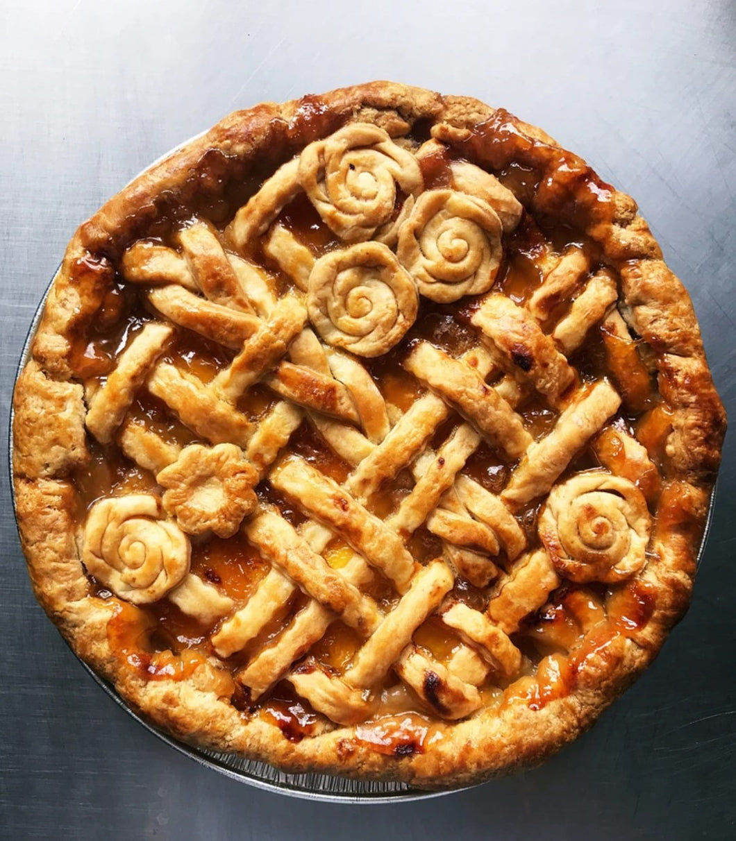gorgeous salted caramel apple pie with lattice and flower cut out crust