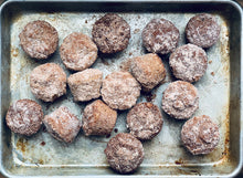 Load image into Gallery viewer, Sugar coated rustic teff muffins on sheet pan.
