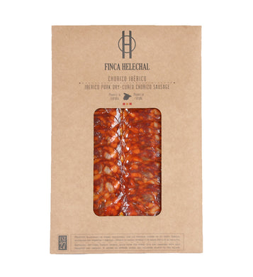 Kraft envelope with clear window showing sliced Iberico chorizo layered flat.  Finca Helechal label, Spain.